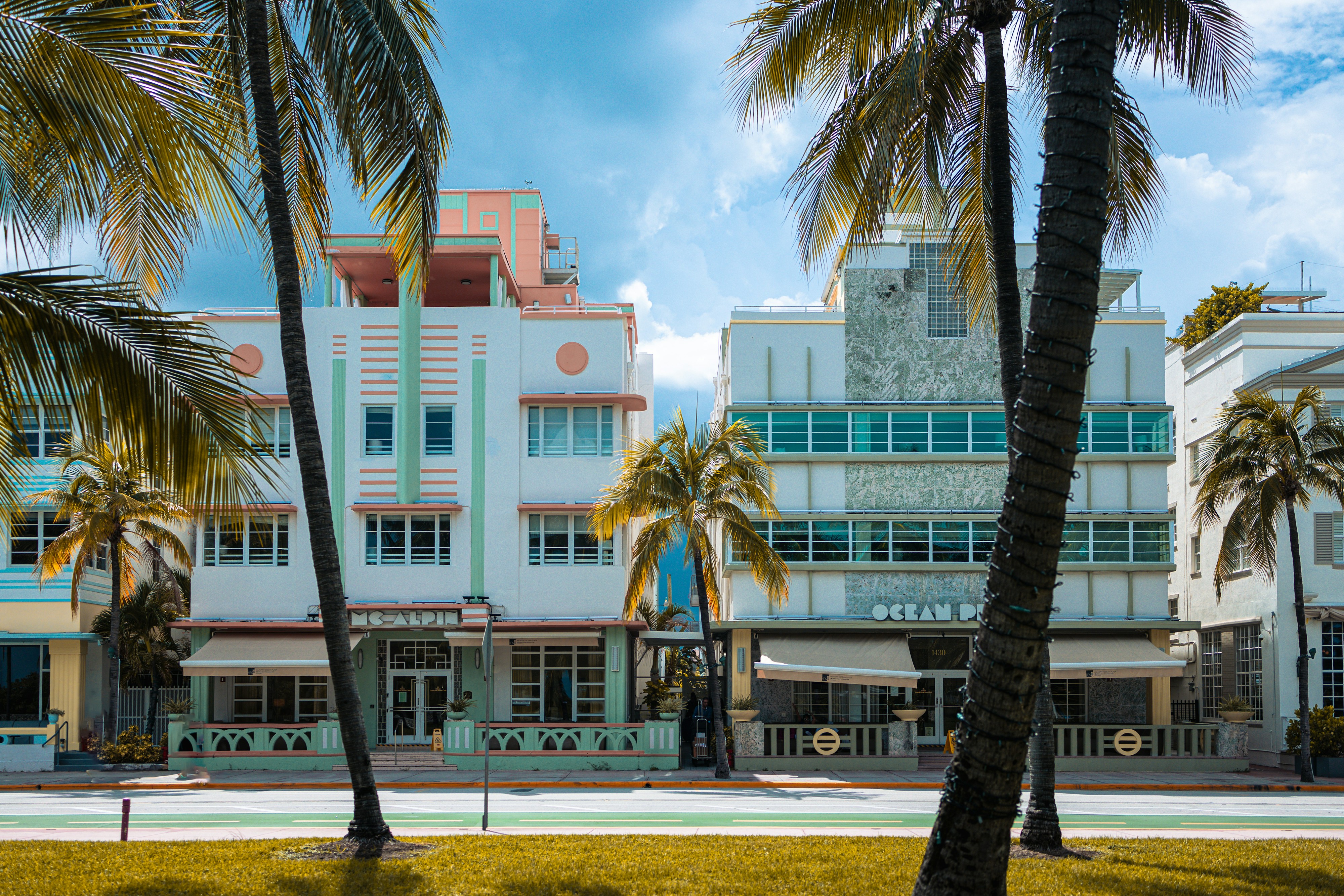 Pastel Art Deco façades on Ocean Drive in South Beach framed by palms